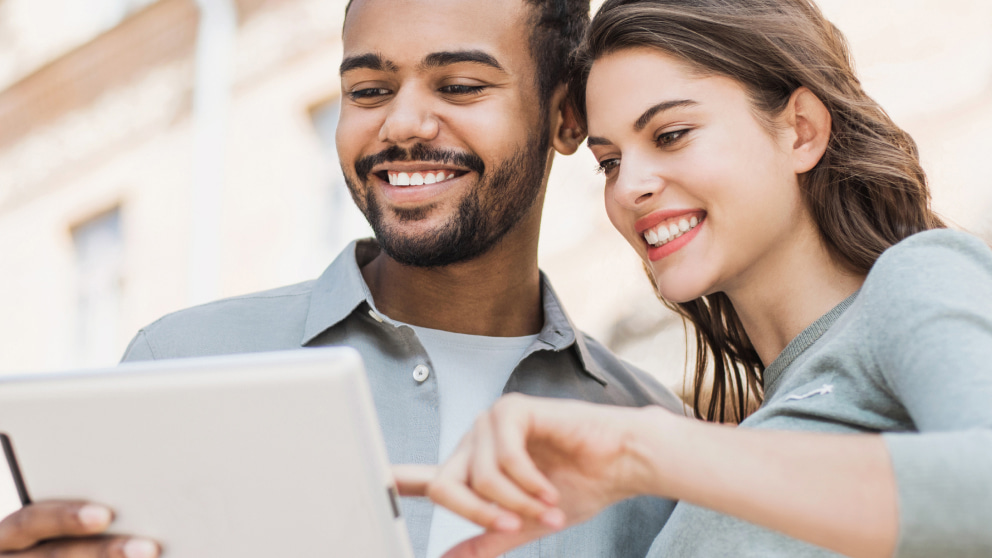 Couple of People Trading CFDs On A Tablet